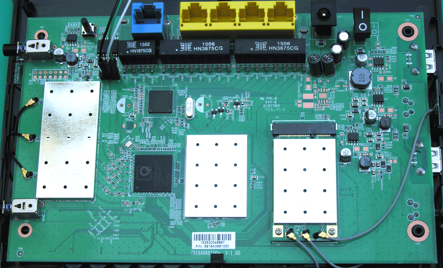 PCB front. Serial is between the WAN port transformer and the shield.